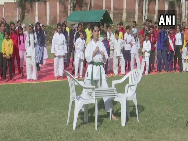 A girl performing a martial art stunt at the camp in Rajouri district of Jammu and Kashmir on Sunday. Photo/ANI