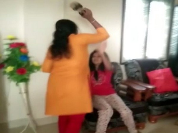 woman could be seen thrashing her husband's lover here in Hyderabad on Thursday 