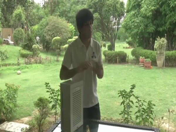 19-year-old Krrish Chawla with the eco-friendly air purifier he developed. (Photo/ ANI)