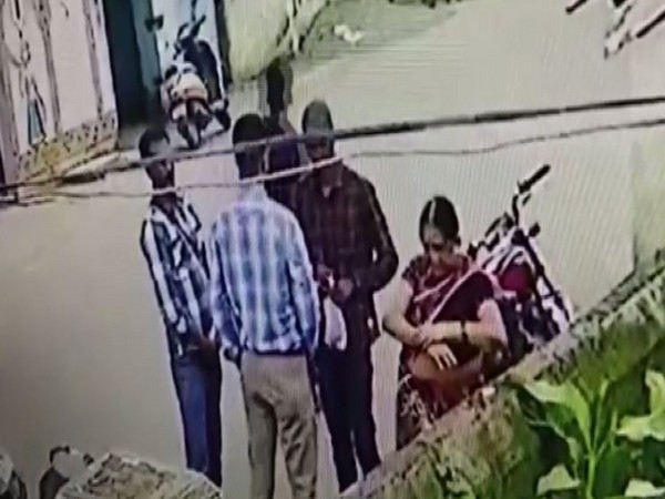 Three men were seen assisting the woman to take off her ornaments in Kalahandi, Odisha, on Friday. Photo/ANI