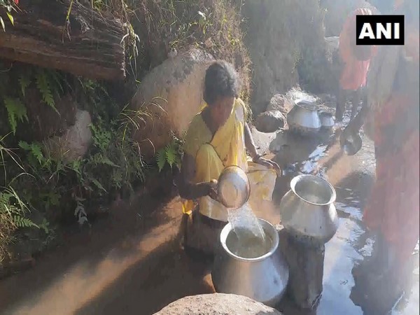 Sanmandra villagers collecting water from drains.