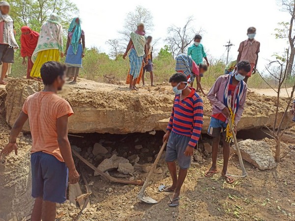 Villagers in Sukma doing repair work of the damaged bridge on Tuesday.
