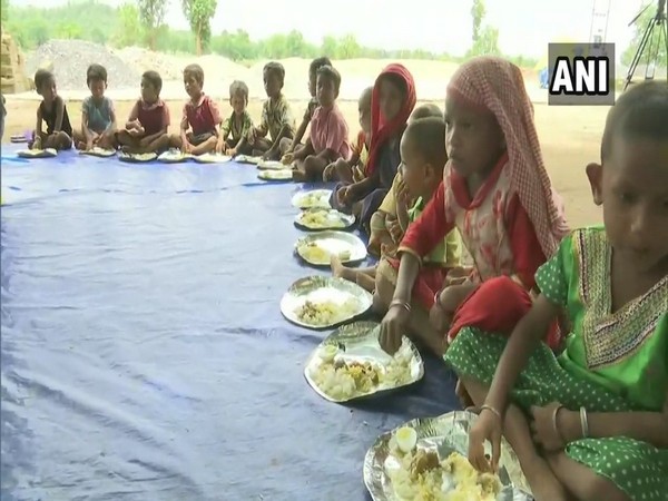 Tribal kids enjoying their lunch in Dantewada, Chhattisgarh on Monday. Photo/ANI