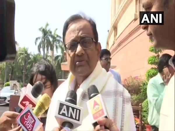 P Chidambaram speaking to reporters outside Parliament on Friday.