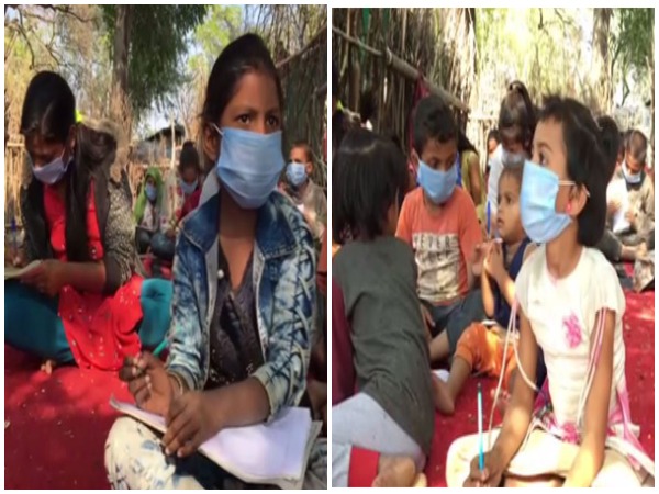 Children studying during a Sunday class arranged by Indore police constable Sanjay Sanwre. (Photo/ANI)