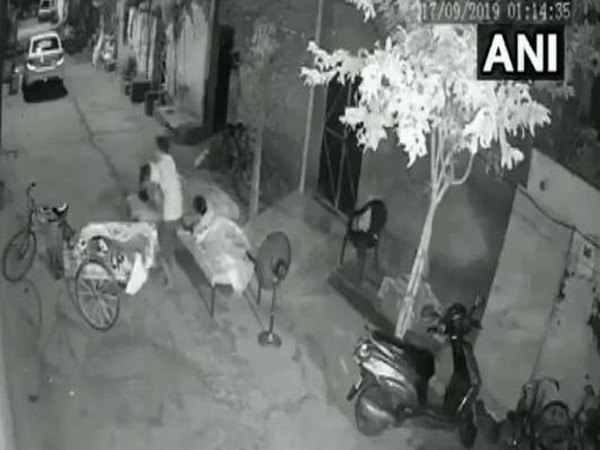 Visuals of a man attempting to steal a child