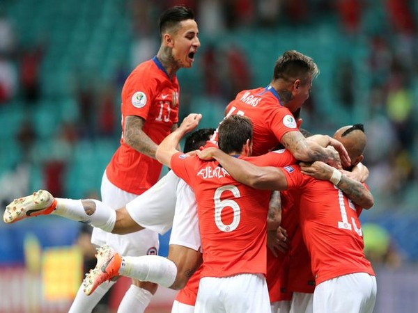 Chile players celebrating after scoring goal against Equador