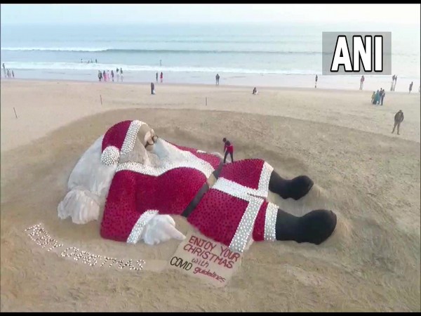 The 50ft long and 28ft wide sand sculpture of Santa Claus on Puri sea beach on Saturday. (ANI/pictures)