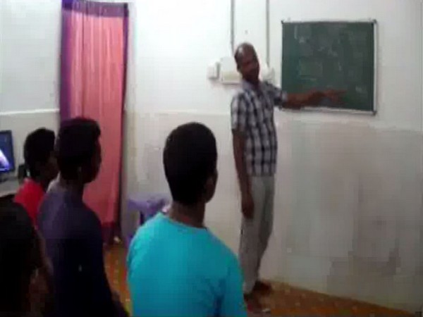 Prisoners being taught in a class at Dantewada district prison