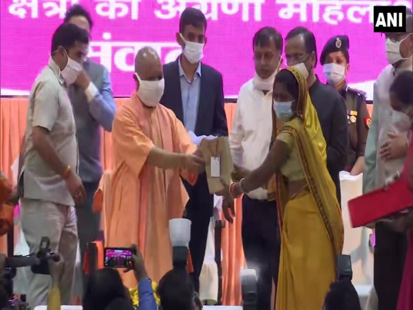 CM Yogi giving the Mission Shakti Awards to woman on the occasion of International Women's Day (Photo/ANI)