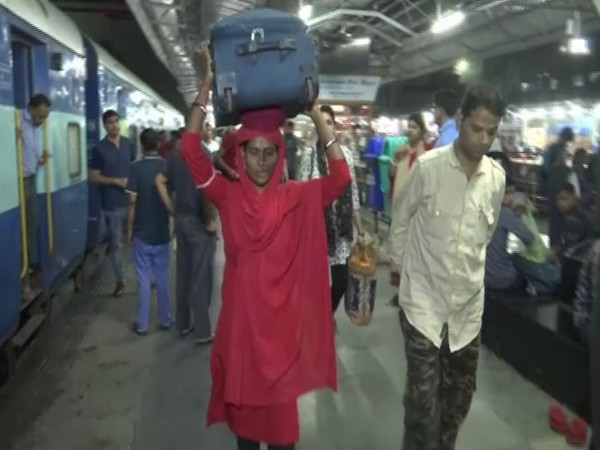 Lakshmi working at Bhopal Junction Raiway station. Photo/ANI