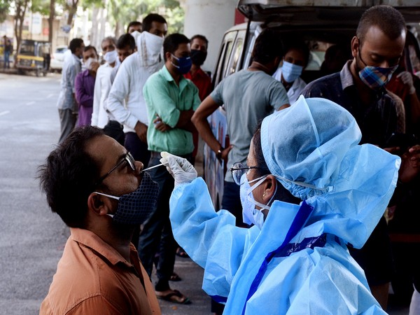 A health workers take nasal swab samples for COVID-19 test. (Photo/ANI)