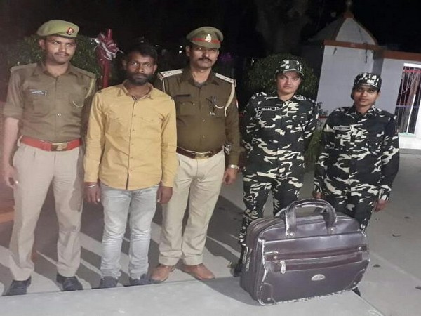 Sashastra Seema Bal (SSB) officers with detained person in Rupaidiha area of Bahraich in Uttar Pradesh on Saturday. (Photo/ANI)