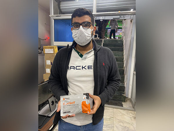 Kanav Nangia, partner at Sunny co pharma, displaying a COVID-19 self-testing kit. [Photo/ANI]