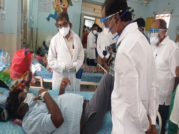 Telangana CM K Chandrasekhar Rao interacting with a patients at the MGM hospital in Warangal. (Photo/ANI)