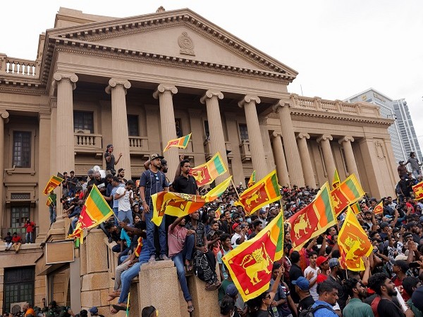 Demonstrators protest inside the Presidential Secretariat premises, after President Gotabaya Rajapaksa fled on Saturday. (Photo Credit: Reuters)