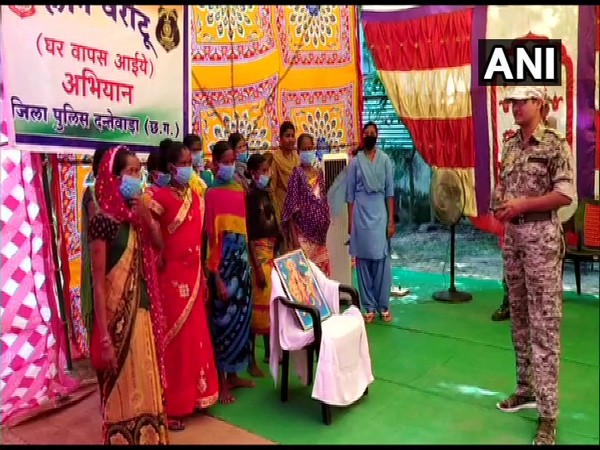 Dantewada SP Abhishek Pallava with Naxals who surrendered before police on Sunday. (Photo/ANI)