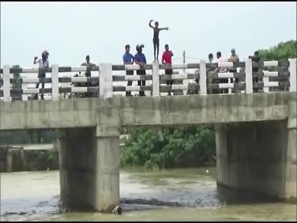 Despite warnings issued by the authorities to the public, many children are being spotted diving into the rivers from various bridges across the district. (Photo/ANI)