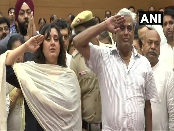 Sushma Swaraj's daughter and husband saluting her mortal remains at BJP headquarters in New Delhi 