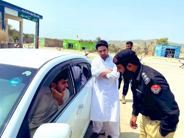 Member of the National Assembly (MNA) Mohsin Dawar being stopped by the Pakistan police. (Photo Credit: Bashir Ahmad Gwakh)
