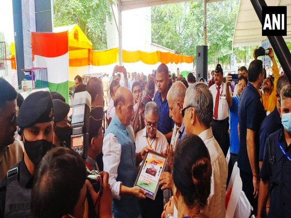Defence Minister Rajnath Singh with the family members of security personnel who lost their lives in the line of duty in Jammu to mark Kargil Vijay Diwas. (ANI/photo)