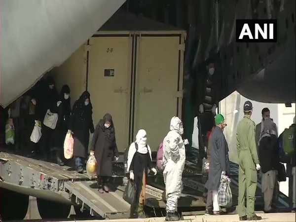 Indians getting down from IAF C-17 at Hindon airbase in Ghaziabad