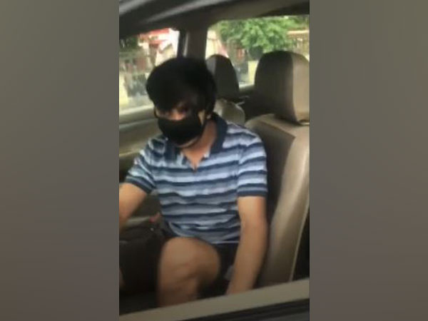 A grab of a video in which a man dragged a Police Officer on Car Bonnet [Photo/ANI]