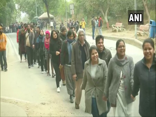 Visuals of the human chain by JNU students and teachers in New Delhi on Monday. 