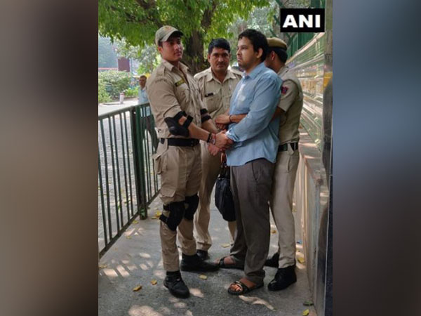 The accused with Delhi police personnel on Tuesday in New Delhi. Photo/ANI