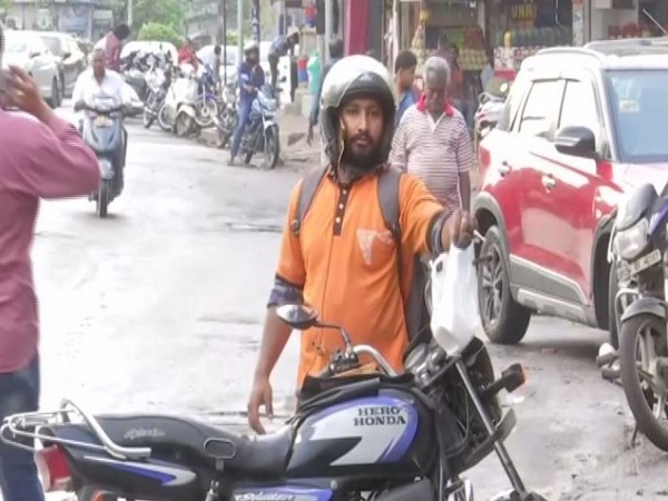 A delivery agent in Hyderabad city of Telangana [Photo/ANI]