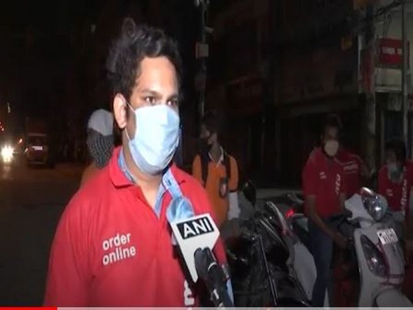 A delivery executive Akash Gupta speaks to ANI in New Delhi [Photo/ANI]