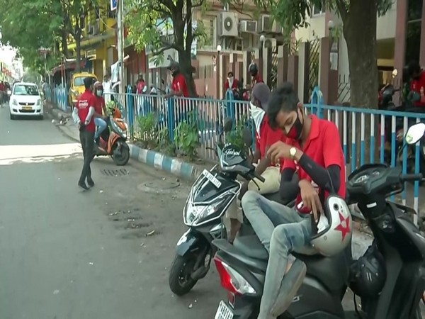 A visual of delivery staff waiting for new orders. Photo/ANI