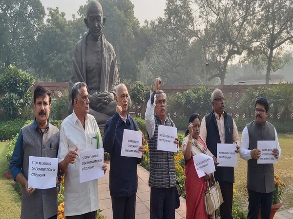 Left parties protesting against CAB in front of Gandhi statue in Parliament complex [Photo/ANI]