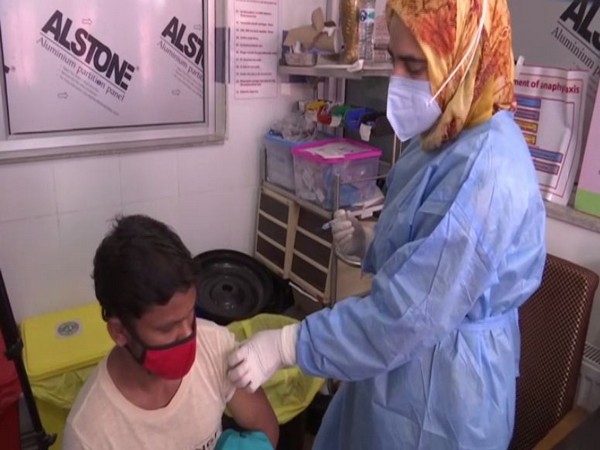 A beneficiary taking his Covid vaccine jab (Photo/ANI).