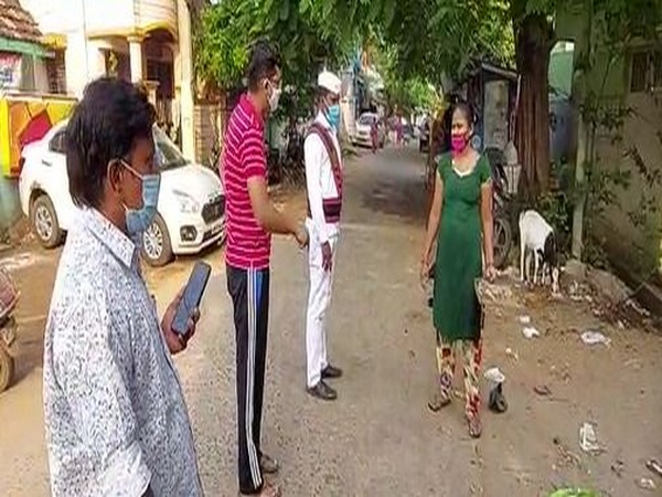 Municipal Commissioner of Kakinada city, Swapnil Dinakar Pundkar, talks to a local resident on Saturday. (Photo/ANI)