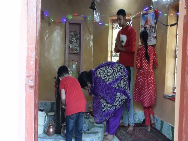 Bhimla Pandita and her family praying at a local temple (Photo/ANI)