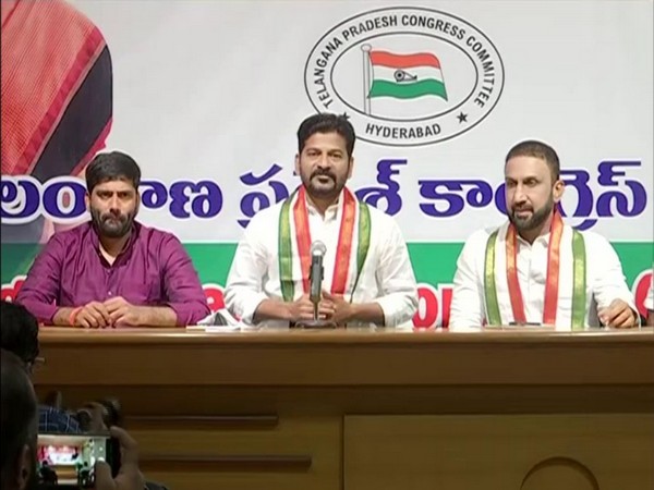 Congress MP Revanth Reddy (Centre) during press conference (Photo/ANI)