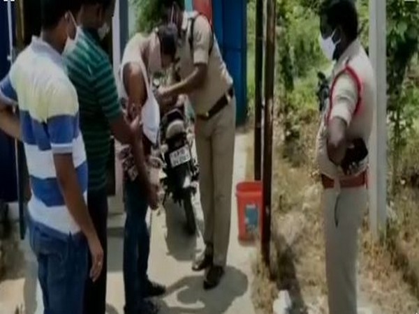 Andhra Police arrests man with 47 liquor bottles taped to his body (Photo/ANI)