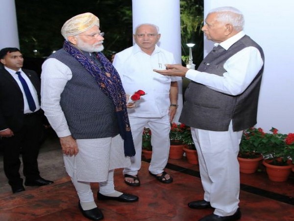 Prime Minister Narendra Modi with Karnataka Chief Minister BS Yediyurappa and Governor Vajubhai Vala in Bengaluru on Thursday. Photo/ANI