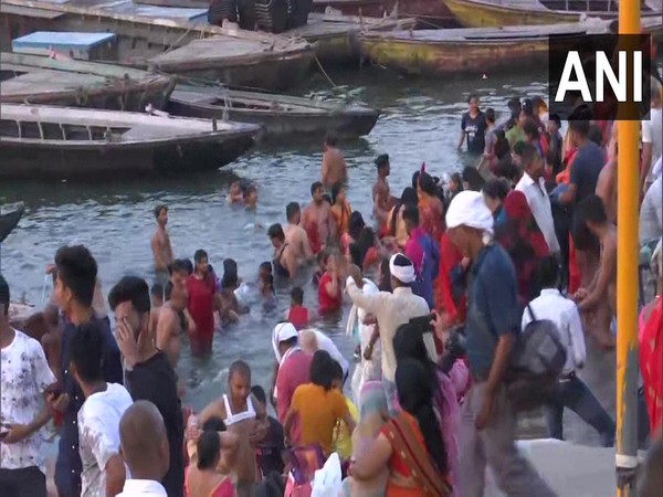 People take holy dip in river Ganga in Varanasi on the occasion of Akshaya Tritiya. (Photo/ANI)