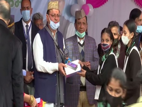 CM Pushkar Singh Dhami distributing tablet on Saturday. (ANI/pictures)