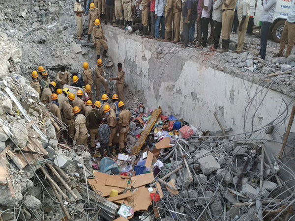 Rescue operation underway at building collapse site in Dharwad, Karnataka, on Friday.