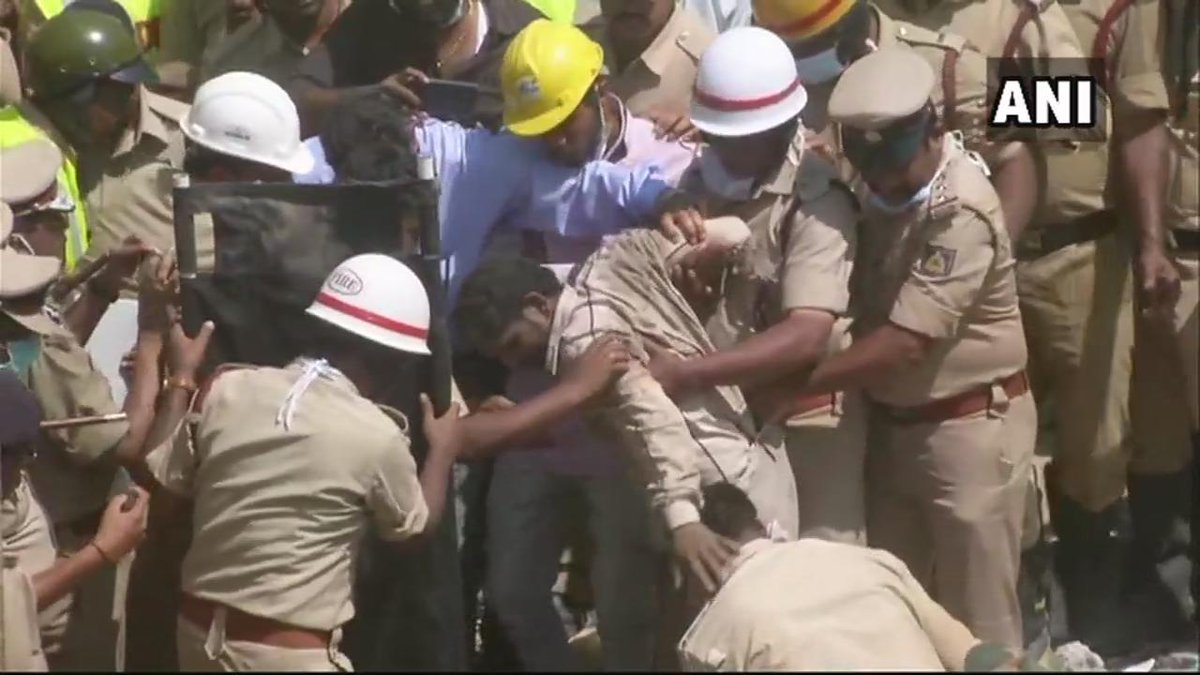 A couple being rescued from Dharwad building collapse site.