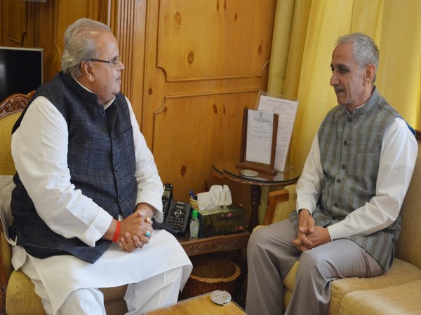 Dineshwar Sharma (right) meeting Jammu and Kashmir Governor Satya Pal Malik (left)