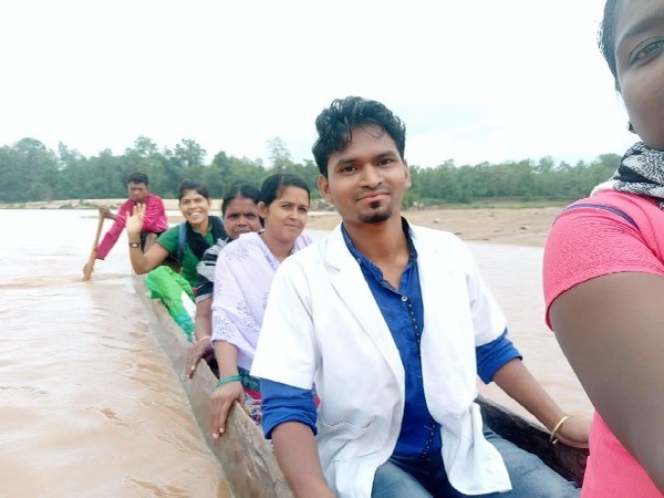 Health workers traveling in boat to reach to tribal people in Bijapur, Chhattisgarh.