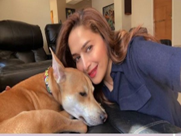 Actor Madhuri Dixit with her pet dog (Image Source: Instagram)
