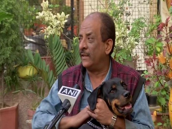 A pet-owner in Chandigarh on Saturday. (Photo/ANI)