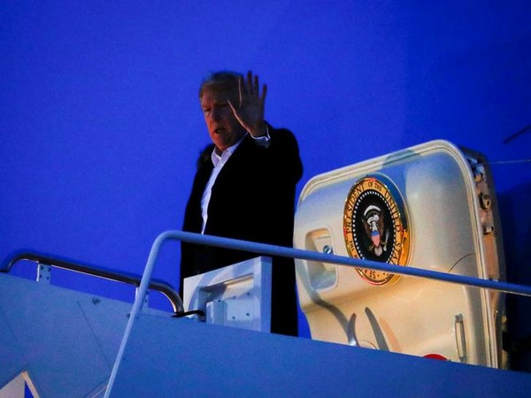 US President Donald Trump waves after returning to Washington DC on Wednesday morning (local time).