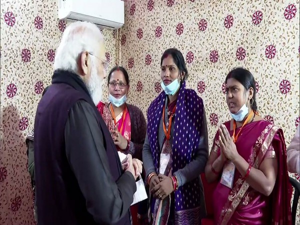 Prime Minister Narendra Modi interacting with beneficiaries of various schemes in Varanasi (Pic credit:  Narendra Modi Twitter handle)