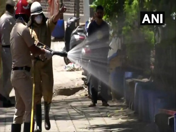 Delhi Police officials sanitising Nizamuddin area on Thursday. Photo/ANI